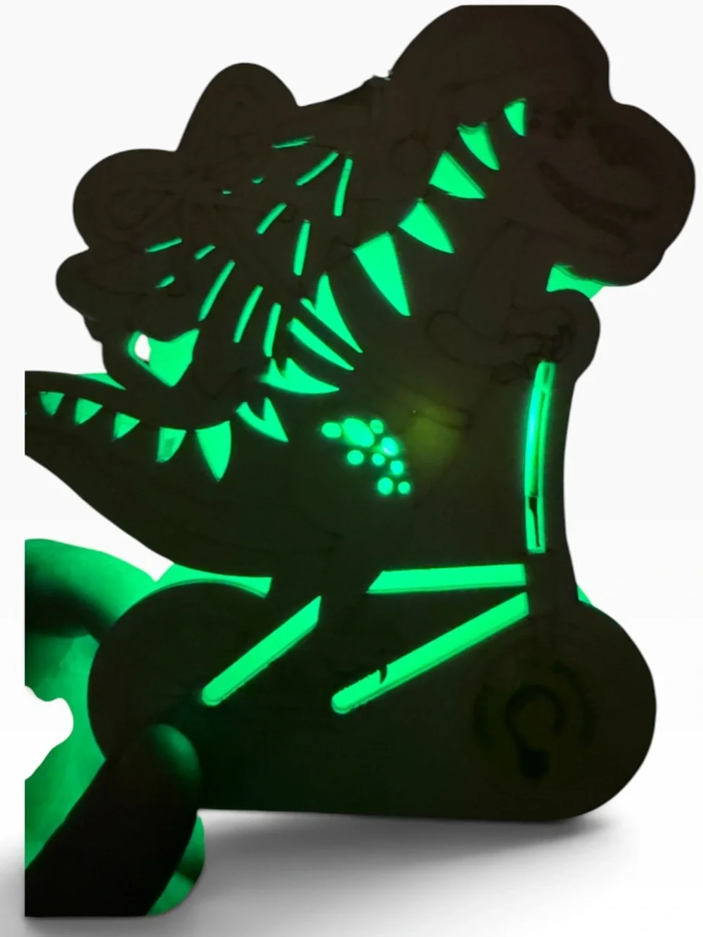 Cut out wood Dino on bike carrying a Christmas tree,